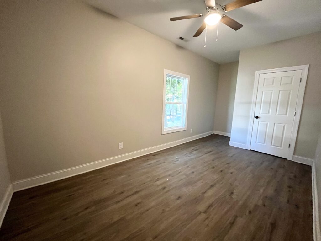 Empty room with one window and door