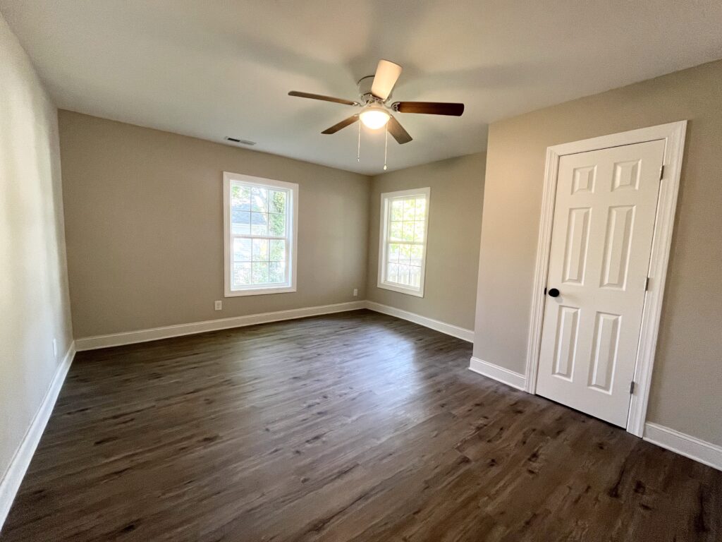 empty room with two window and door