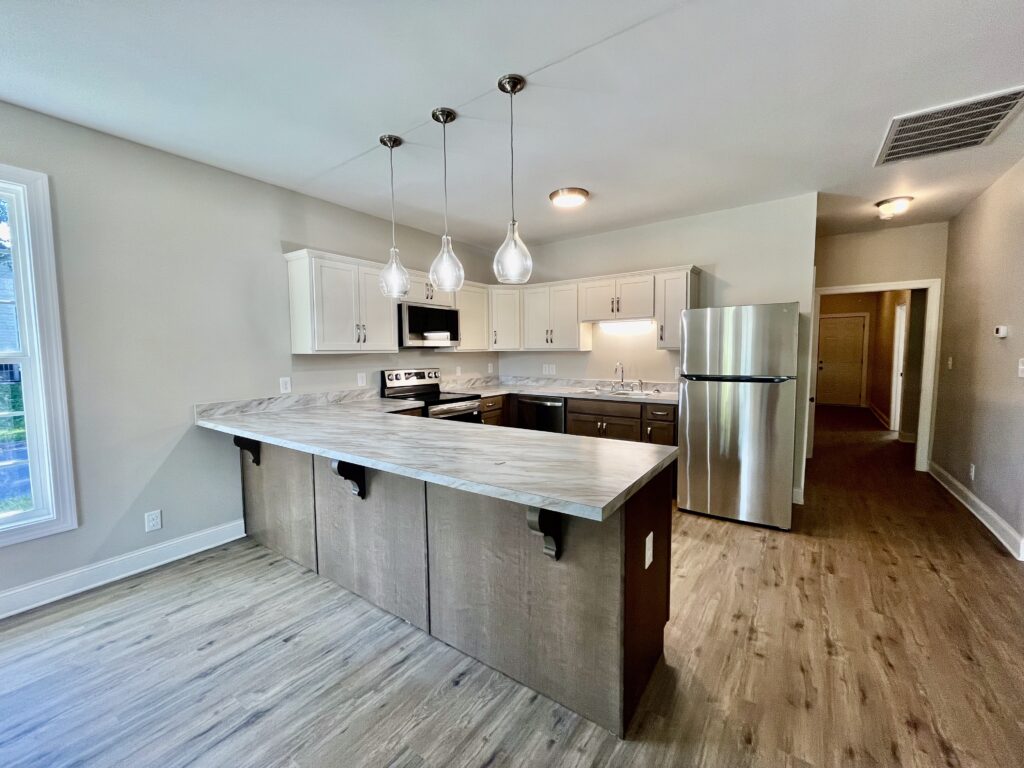 kitchen with fridge, microwave oven and cooking range
