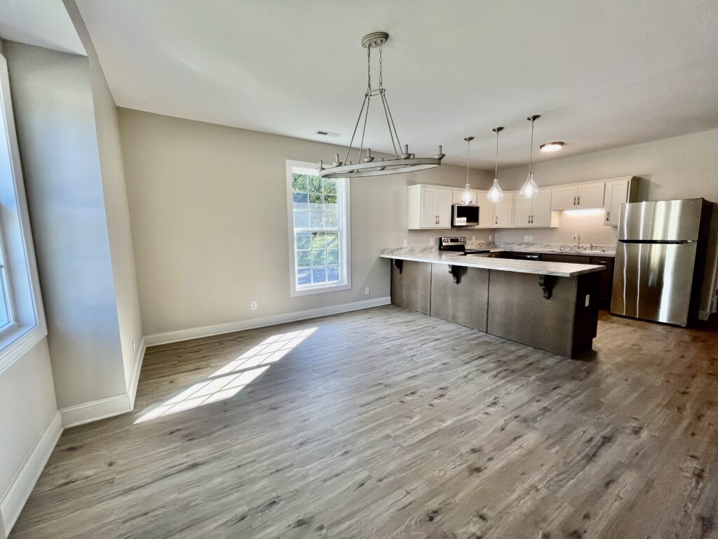 kitchen with fridge, microwave oven and cooking range